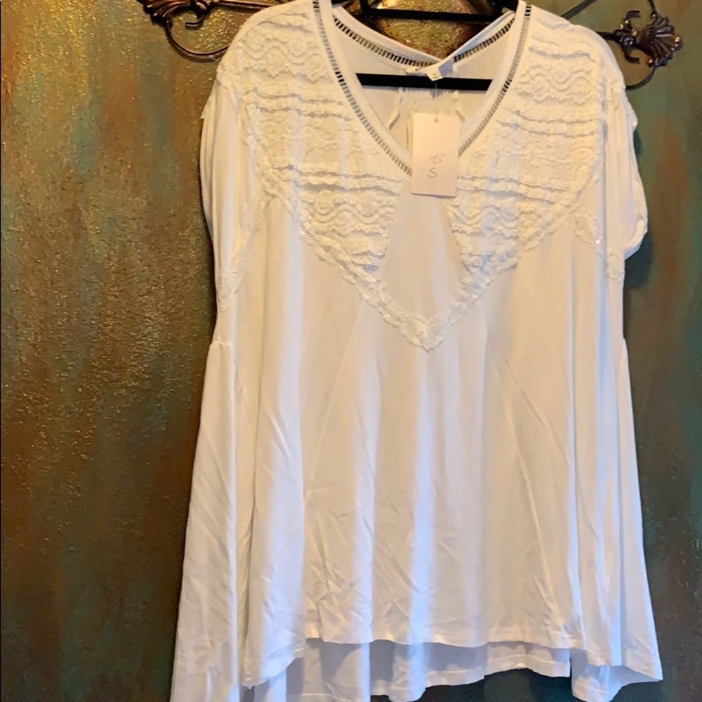 Oversize top with beautiful detail!